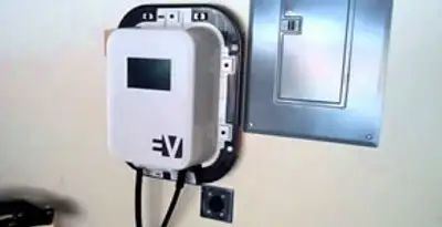 Electric car charger installation with wall-mounted EV charging station in Naperville, IL