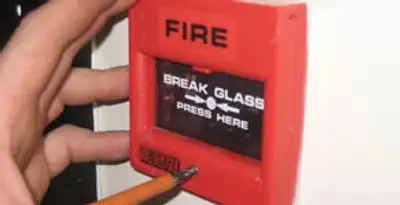 fire alarm installation service showing manual fire alarm pull station installed by licensed electricians in Naperville, IL