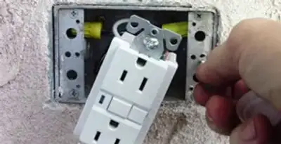 gfci circuits service showing installation of a ground fault circuit interrupter outlet by licensed electricians in Naperville, IL