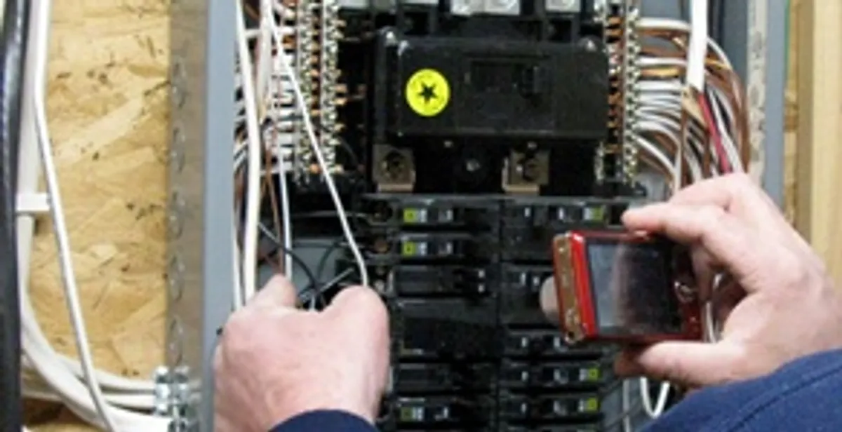 Home electrical inspection of circuit breaker panel by licensed electrician in Naperville, IL