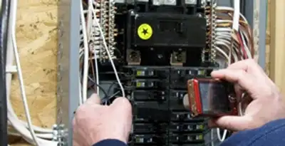 Home electrical inspection of circuit breaker panel by licensed electrician in Naperville, IL