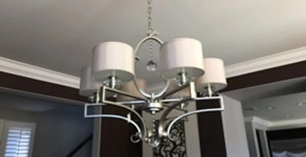 Modern chandelier installation with multiple light fixtures in Naperville, IL