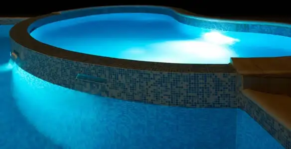 pool light installation and repair services highlighting illuminated pool interior lighting in Naperville, IL