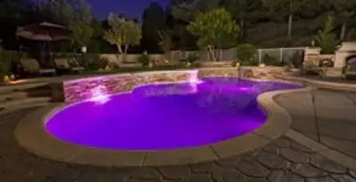 pool light installation and repair services illuminating a residential swimming pool in Naperville, IL