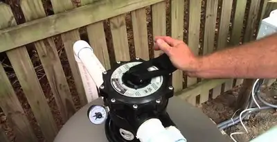 pool pumps service showing professional adjustment of pool pump control system in Naperville, IL