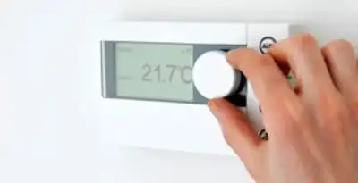 Thermostat installation service with professional adjusting temperature control in Naperville, IL