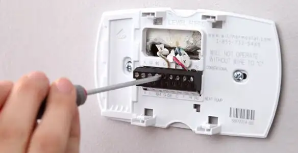 Thermostat installation service with proper wiring and secure wall mounting in Naperville, IL